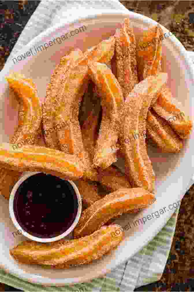 Crispy Churros, Sprinkled With Cinnamon Sugar, Served On A Plate Famous Classic Spanish Desserts With Jane Eyre: Explore Delectable Traditional Sweets From Spain